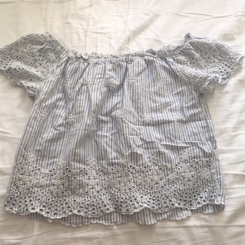 blue and white off the shoulder shirt.